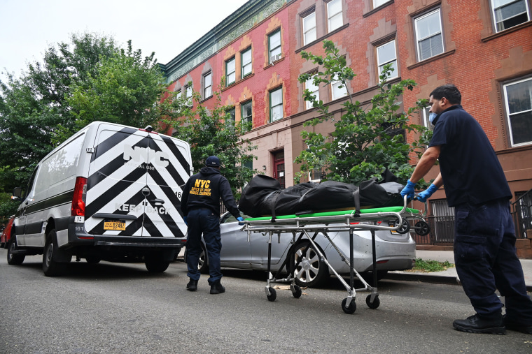 Members of the New York City Office of Chief Medical Examiner remove the body of Influencer model Jacob Zieben-Hood in Harlem, New York, on Aug. 1.