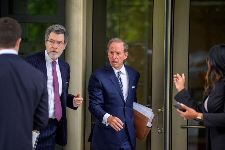 Attorneys Norman Eisen, left, and Abbe Lowell, representing Federal Reserve governor Lisa Cook, depart federal court on Aug. 29, 2025.