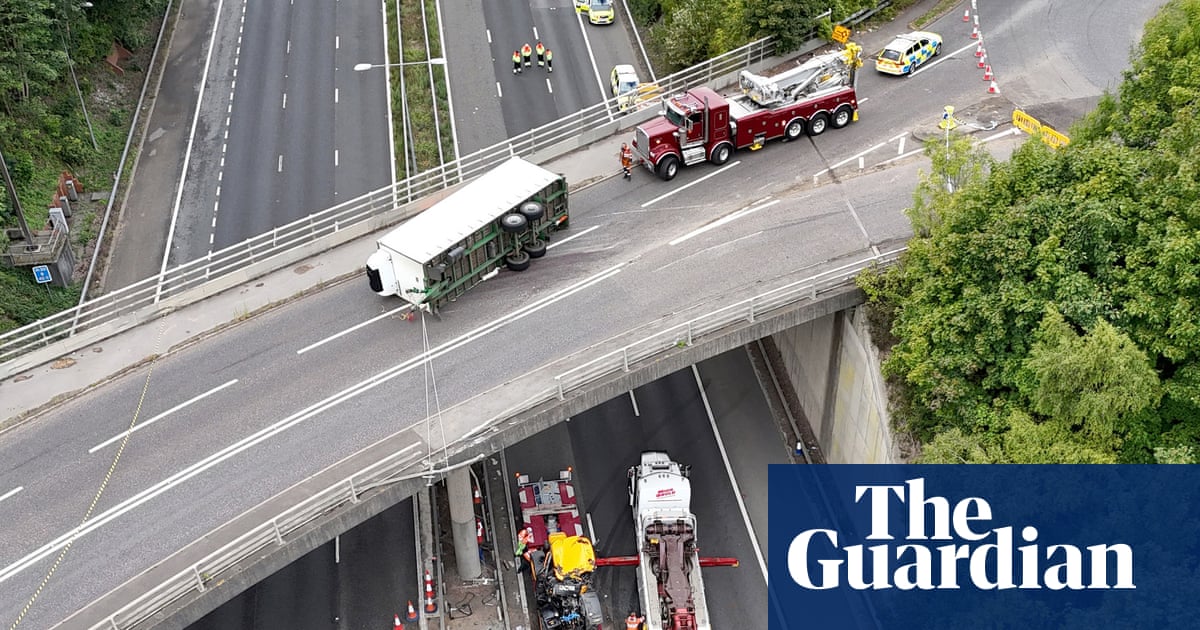 Tractor falls from bridge on to M20 leaving driver critically injured | Road transport