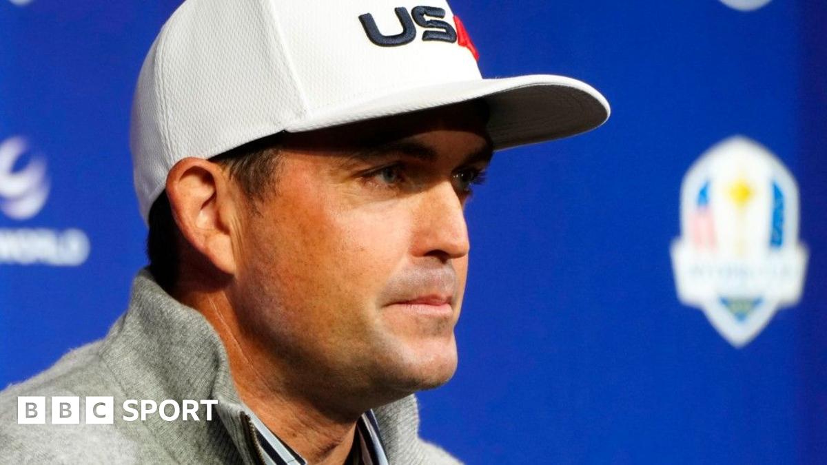 Keegan Bradley wearing a USA baseball cap at the United States team news conference