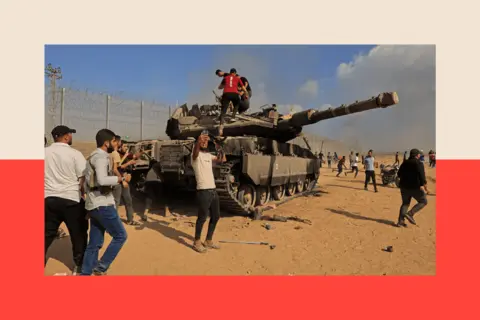 SAID KHATIB/AFP via Getty Images Palestinians climb on an Israeli Merkava battle tank after crossing the border fence with Israel from Khan Yunis in the southern Gaza Strip 