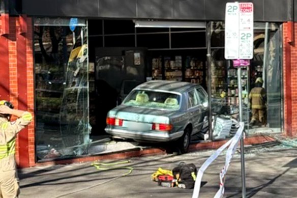 Emergency personnel at the scene of the crash. The 87-year-old driver was uninjured.