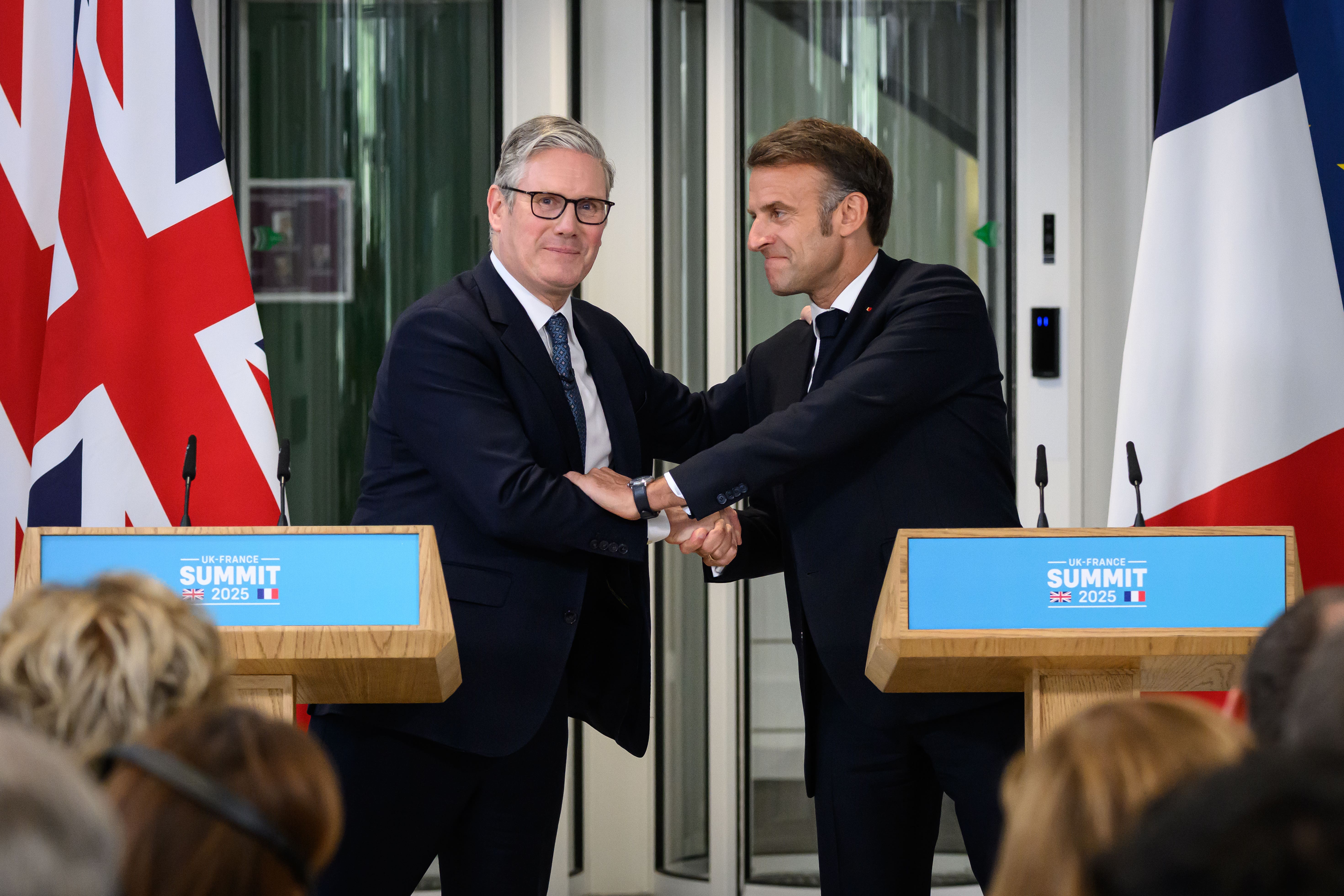 Sir Keir Starmer and Emmanuel Macron announced the ‘one in, one out’ deal during the French president’s state visit last month (Leon Neal/PA)