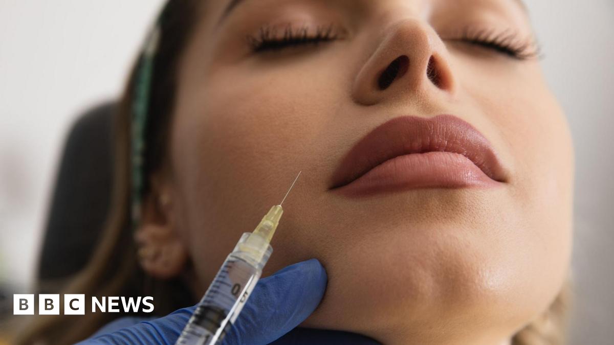 David Lochridge in a submersible looking out at an underwater reef