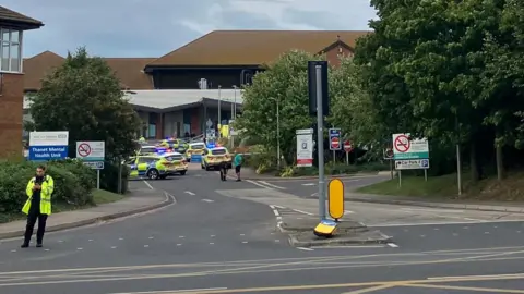 Maddie Murphy A number of police cars outside QEQM hospital in Margate  