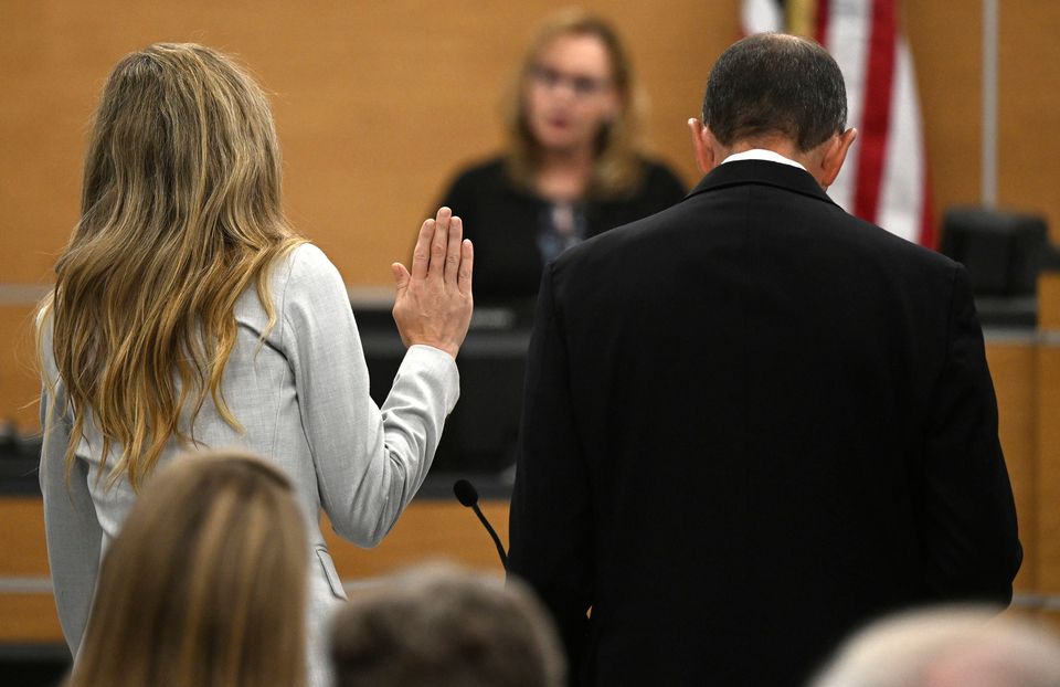 Molly, left, swears on the bible as she pleads no contest to voluntary manslaughter