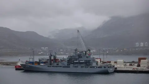 Getty Images A naval ship is moored in Nuuk against a backdrop of mountains