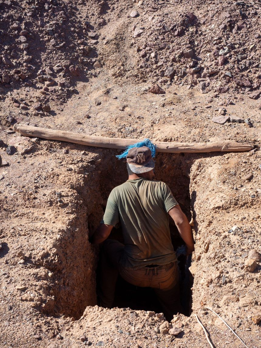 A fossil miner works at a mine near Erfoud, Morocco.