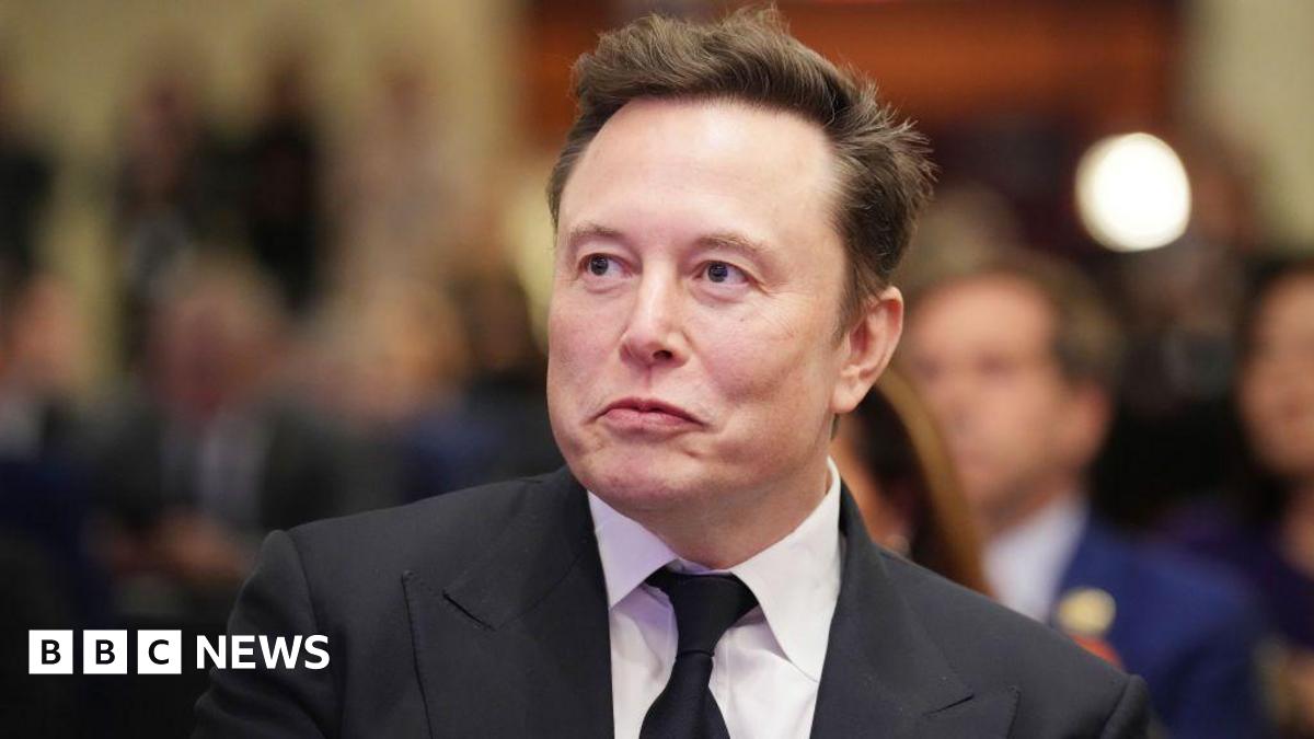 Elon Musk listens as US President-elect Donald Trump addresses a House Republicans Conference meeting at the Hyatt Regency on Capitol Hill on November 13, 2024 in Washington, DC.