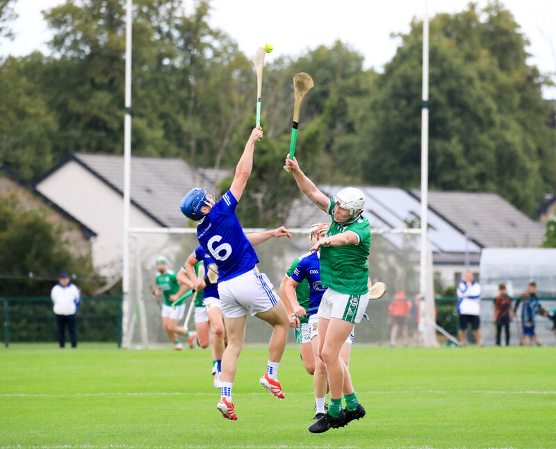 Ballinhassig's Darragh O'Sullivan and Ballincollig's Stephen Wills rise for the dropping ball. Picture: David Creedon