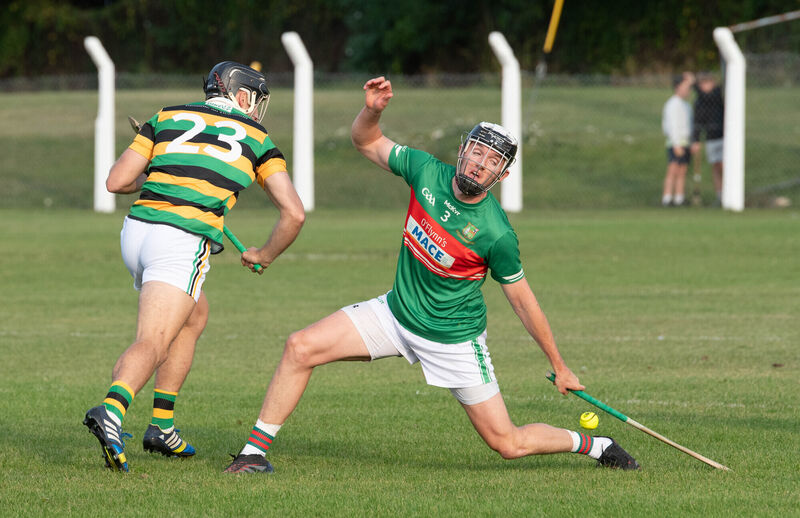 Glen Rovers' Simon Kennefick has his shot blocked by Ger Millerick of Fr O'Neill's. Picture: Howard Crowdy