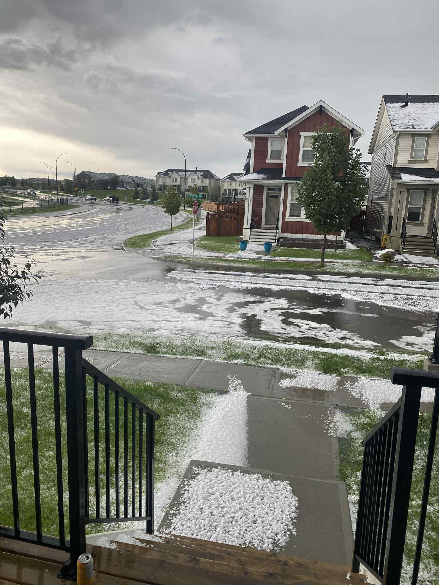 Hail covered lawns and streets in Airdrie on Thursday afternoon after a fast-moving storm swept through the city.