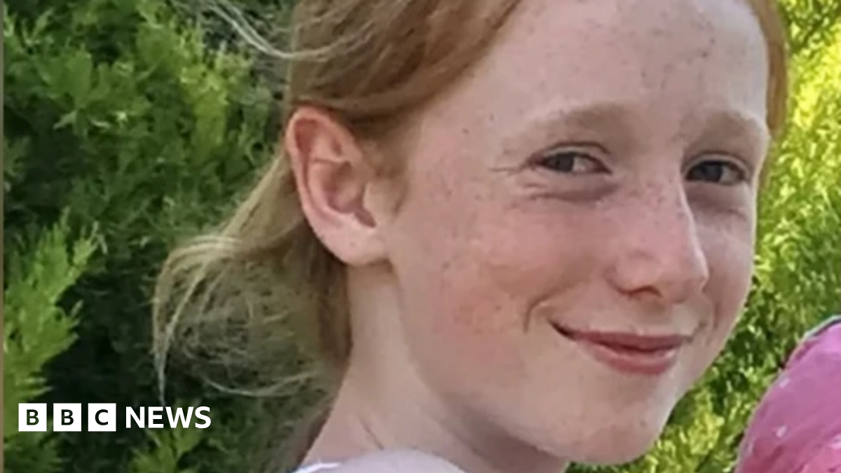 A picture of Ruth Szymankiewicz, a teenage girl who is smiling at the camera and has shoulder-length ginger hair.