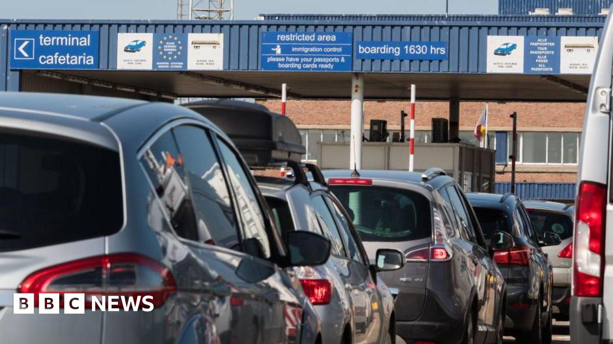 Cars queue at a customs border passport check at the Port of Zeebruge in Belgium