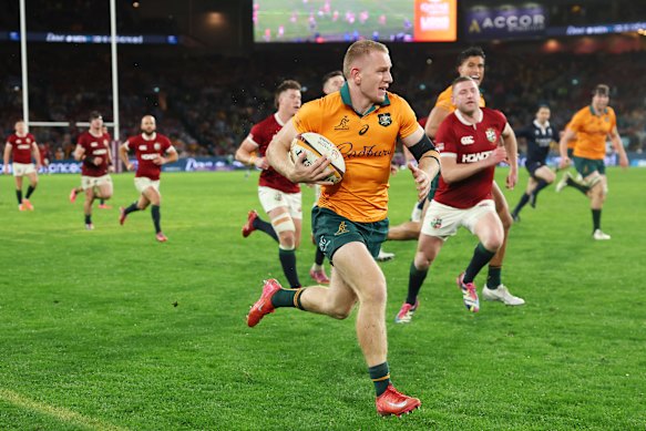 Max Jorgensen of the Wallabies breaks with the ball to score a try