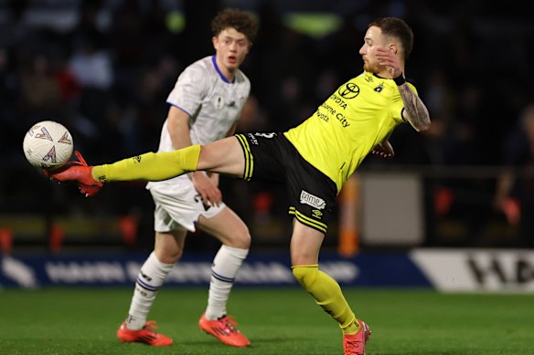 Anthony Lesiotis of Heidelberg United FC controls the ball.