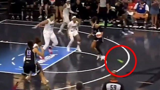 An adult device thrown onto the court disrupts play late in the fourth quarter of the Atlanta Dream's game against the Golden State Valkyries.