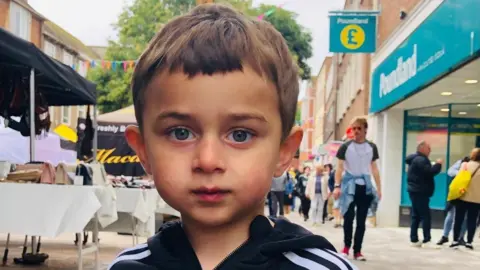Navid Feizi A close up image of Zaahir Jan on a high street looking to camera