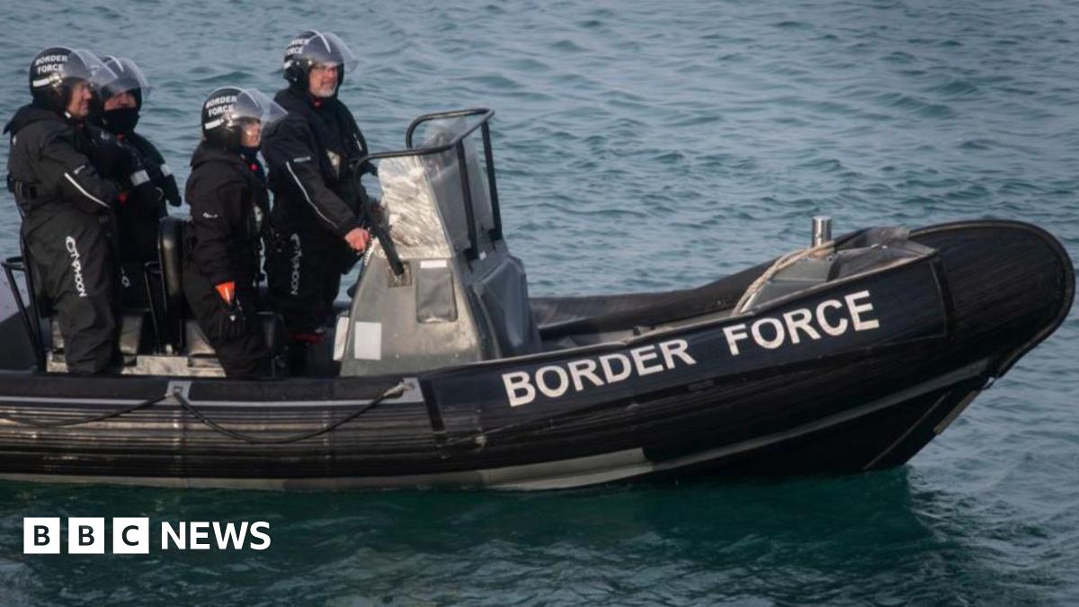 David Lochridge in a submersible looking out at an underwater reef