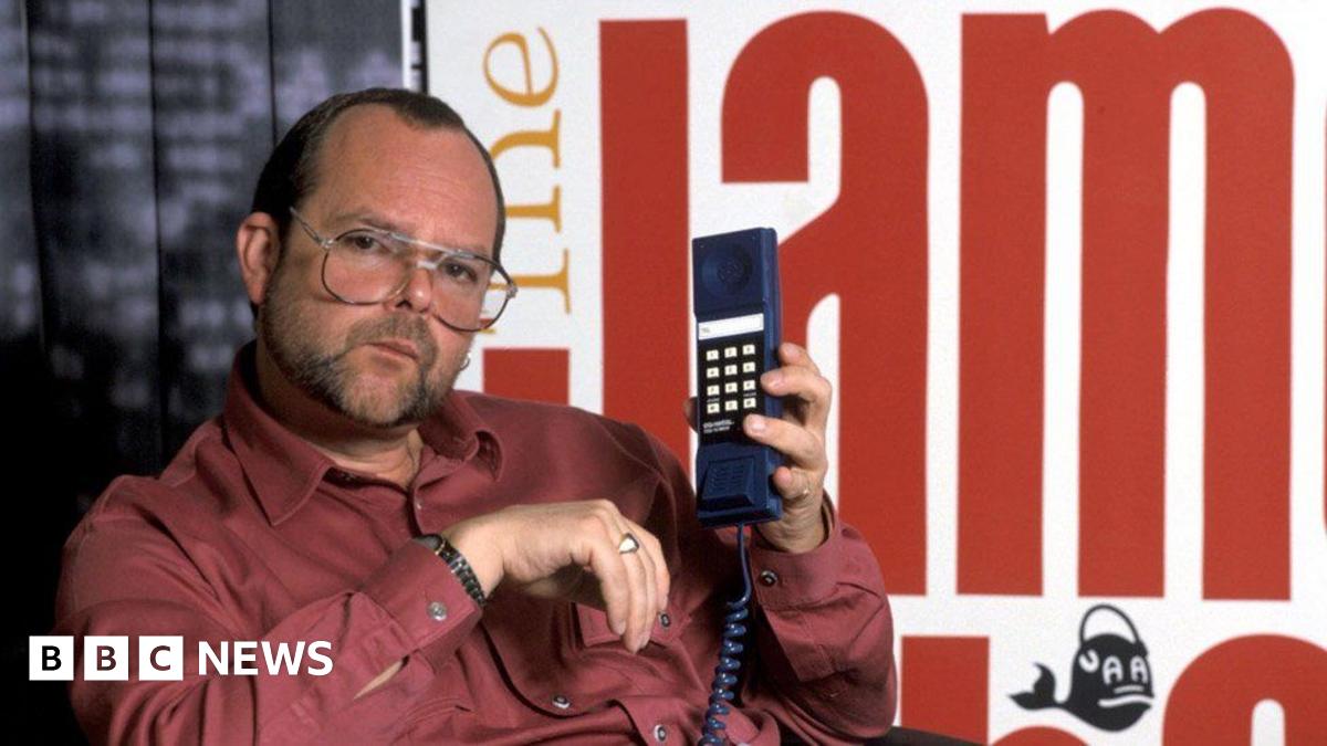 James Whale is photographed holding up a phone handset in a publicity shot for his Radio Show in the 1980s