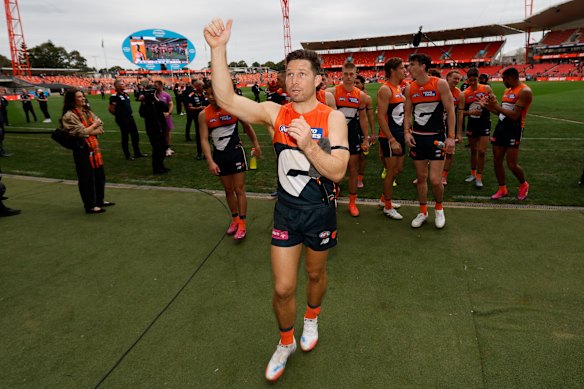 Greene leads the Giants off the field Engie Stadium after securing a home final.
