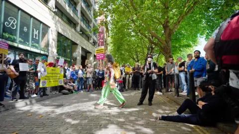 PA Media Protesters carrying pro-immigration and anti-racism placards surrounding the hotel in Bristol.