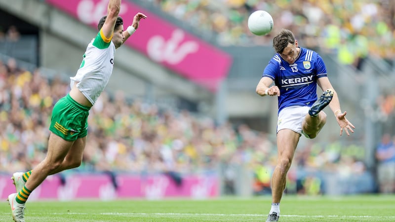 David Clifford scores a two-pointer during the All-Ireland final despite Donegal's Brendan McCole. Photograph: Laszlo Geczo/Inpho