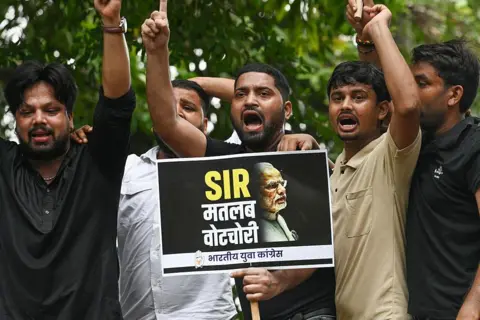 Hindustan Times via Getty Images Indian Youth Congress supporters held placards and shouted slogans during a protest against the Special Intensive Revision (SIR) of the electoral roll conducted by the Election Commission in Bihar in Delhi