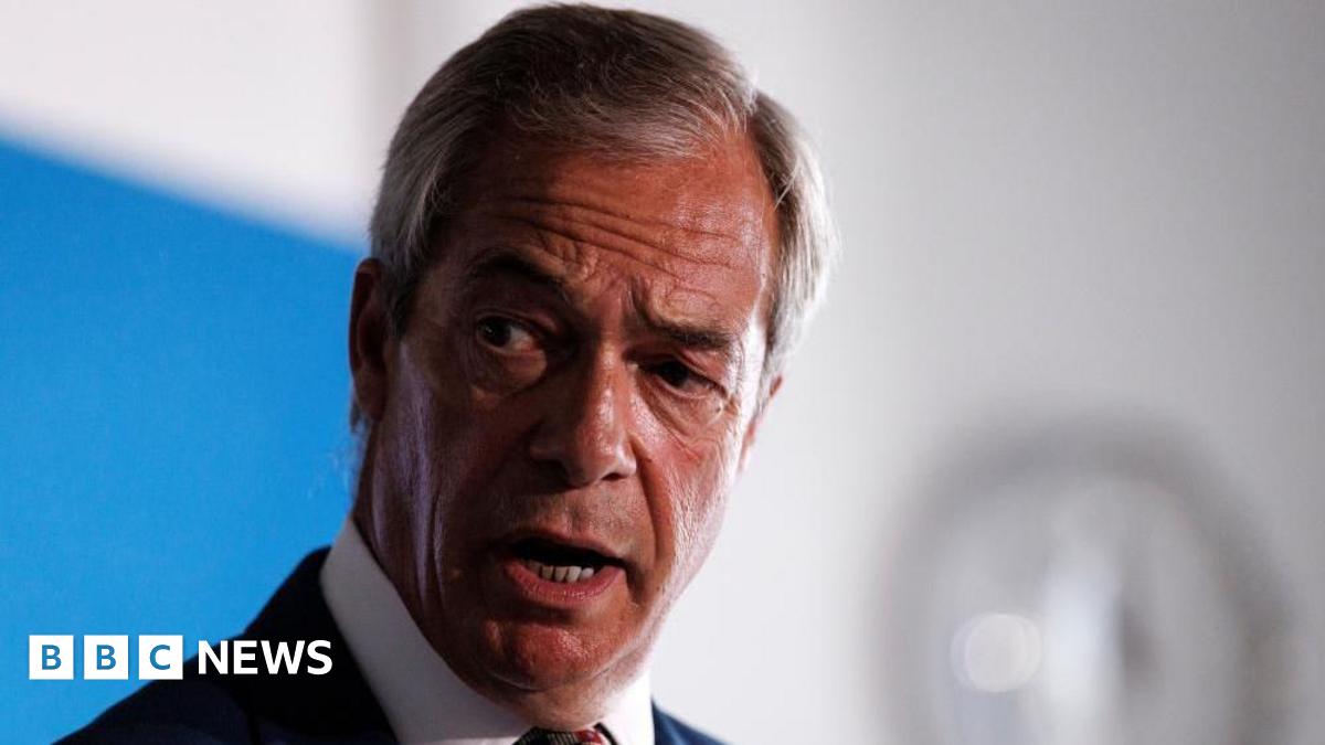 Headshot of Nigel Farage speaking a news conference. He is wearing a dark suit and multi-coloured tie.