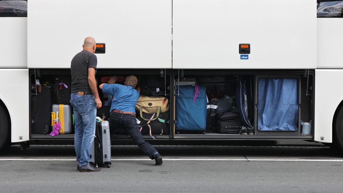 New Zealand woman arrested after two-year-old girl found alive in suitcase stowed in bus luggage