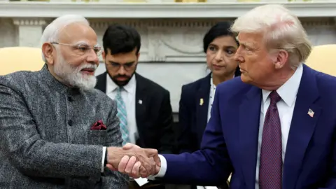 Reuters U.S. President Donald Trump and Indian Prime Minister Narendra Modi shake hands, at the White House in Washington, D.C., U.S., February 13, 2025. REUTERS/Kevin Lamarque/File Photo
