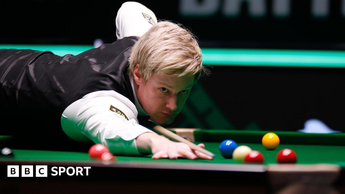 Neil Robertson plays a shot