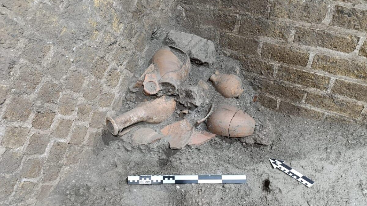 Amphorae stacked up in the corner of a room in Pompeii.