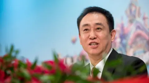 Getty Images Hui Ka Yan, chairman of China Evergrande Group, speaks during a news conference in Hong Kong, China, on Tuesday, March 26, 2019.