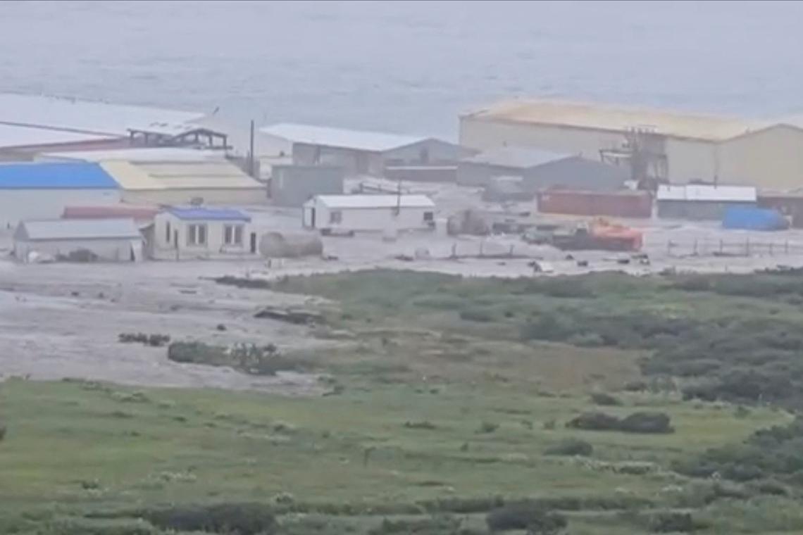 FILE PHOTO: A powerful wave washes past a building located near the shore, after a powerful earthquake struck off the Kamchatka Peninsula, in Severo-Kurilsk, Sakhalin Region, Russia July 30, 2025 in this screen grab obtained from social media video Social media/via REUTERS/File Photo