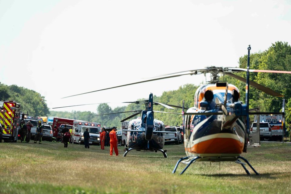 Authorities respond to a large accident involving a tour bus on the eastbound I-90 near Pembroke, N.Y., Friday, Aug. 22, 2025. (Libby March/The Buffalo News via AP)