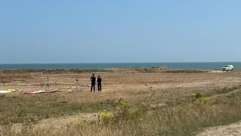 PA Media Police at the scene in the Leysdown-on-Sea resort on the Isle of Sheppey