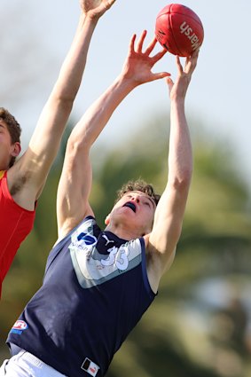 Louis Emmett flies high for a mark for Victoria Metro at last year’s national championships.