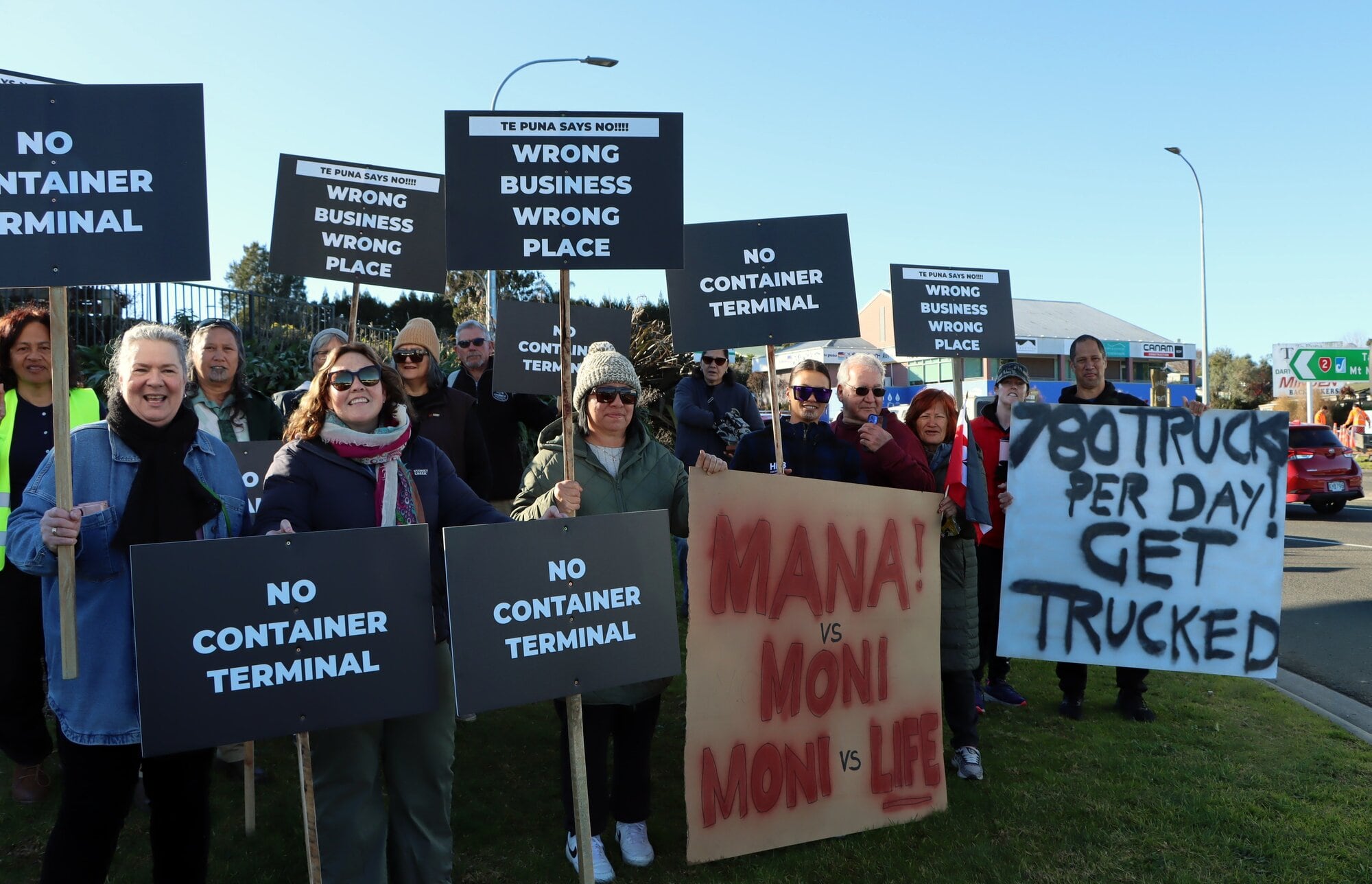 Around 30 Te Puna locals gathered to protest against the Te Puna industrial park. Photo / Alisha Evans