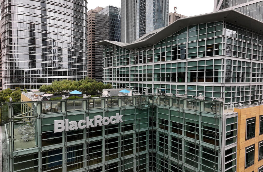 In an aerial view, the BlackRock logo is displayed on the exterior of a BlackRock office on July 15, 2024 in San Francisco, California 