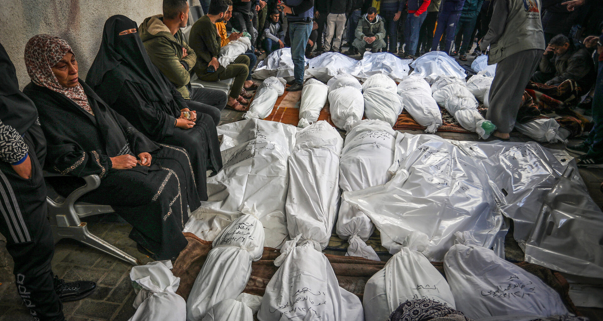 Palestinians wait to receive the bodies of their relatives who were killed in an Israeli airstrike, at Al-Najjar Hospital, southern Gaza Strip, December 7, 2023. (Abed Rahim Khatib/Flash90)