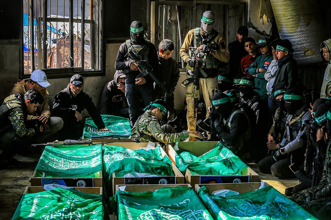 Hamas members attend the funeral of Al-Qassam Brigades fighters who were killed by the Israeli army in recent months, in Al-Hajj Musa Mosque in Khan Younis, southern Gaza Strip, January 31, 2025. (Abed Rahim Khatib/Flash90)