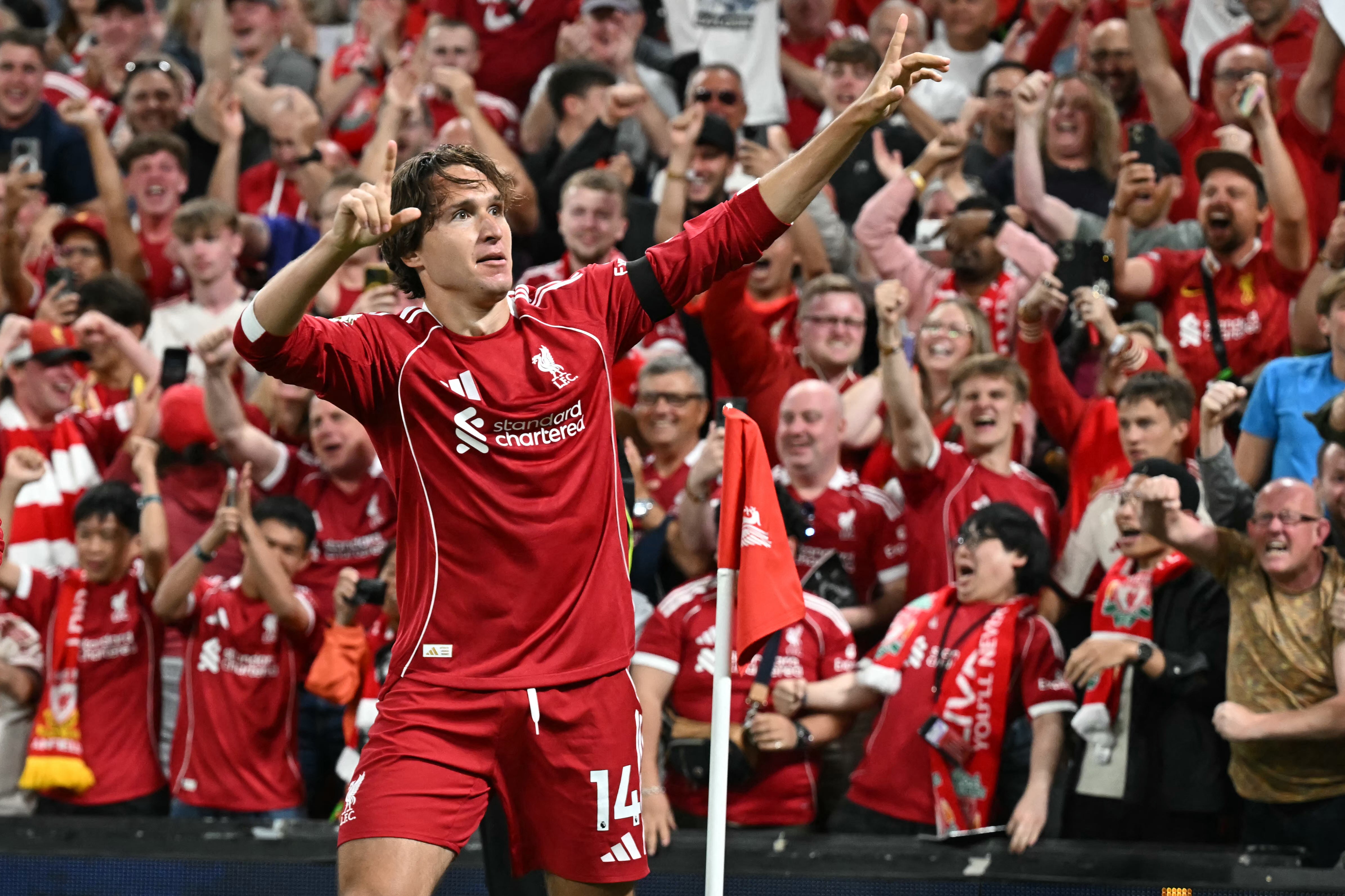 Federico Chiesa salutes the Liverpool fans after scoring