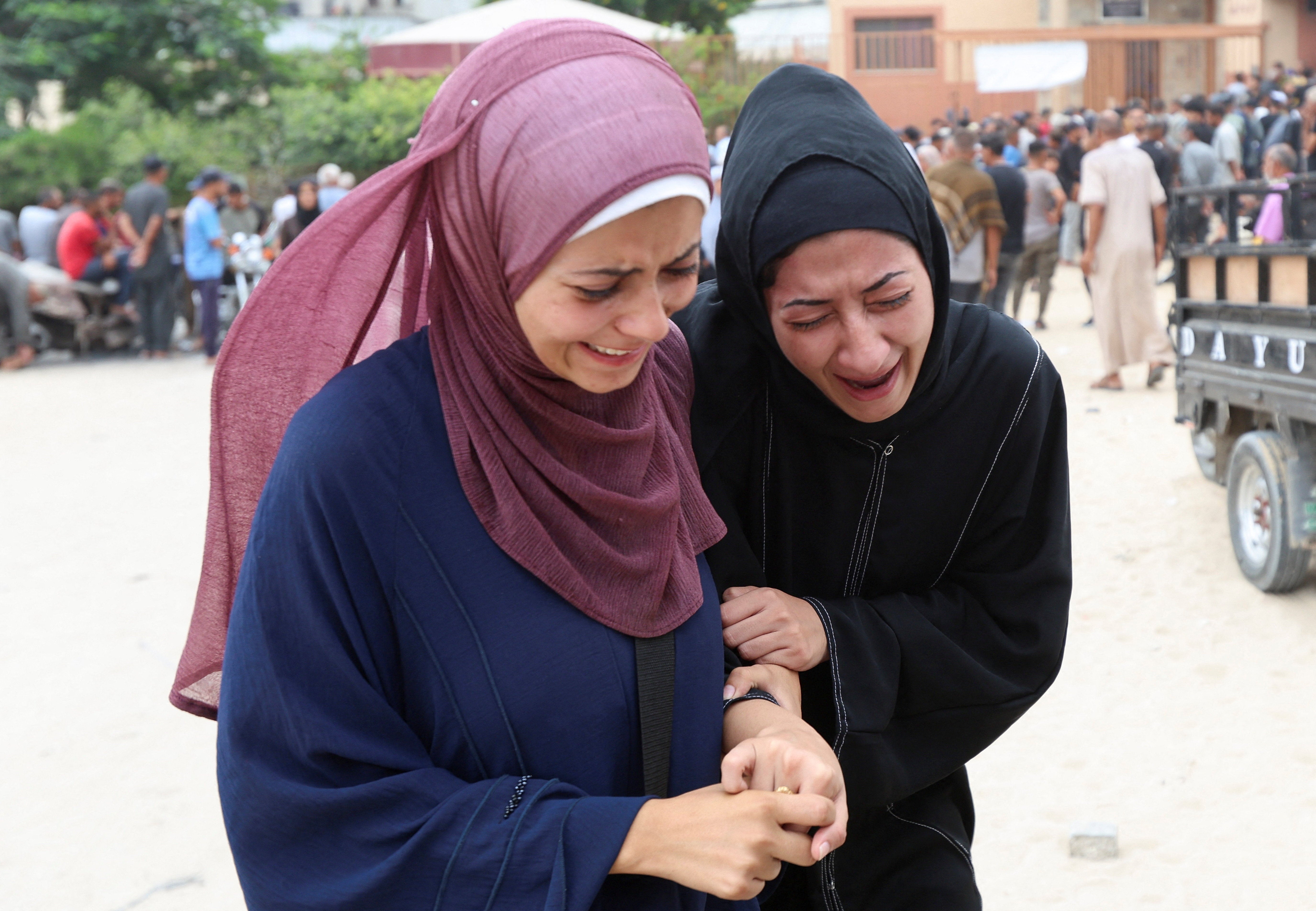 Mourners at the funeral of Palestinians killed by Israeli fire while trying to receive aid on Thursday