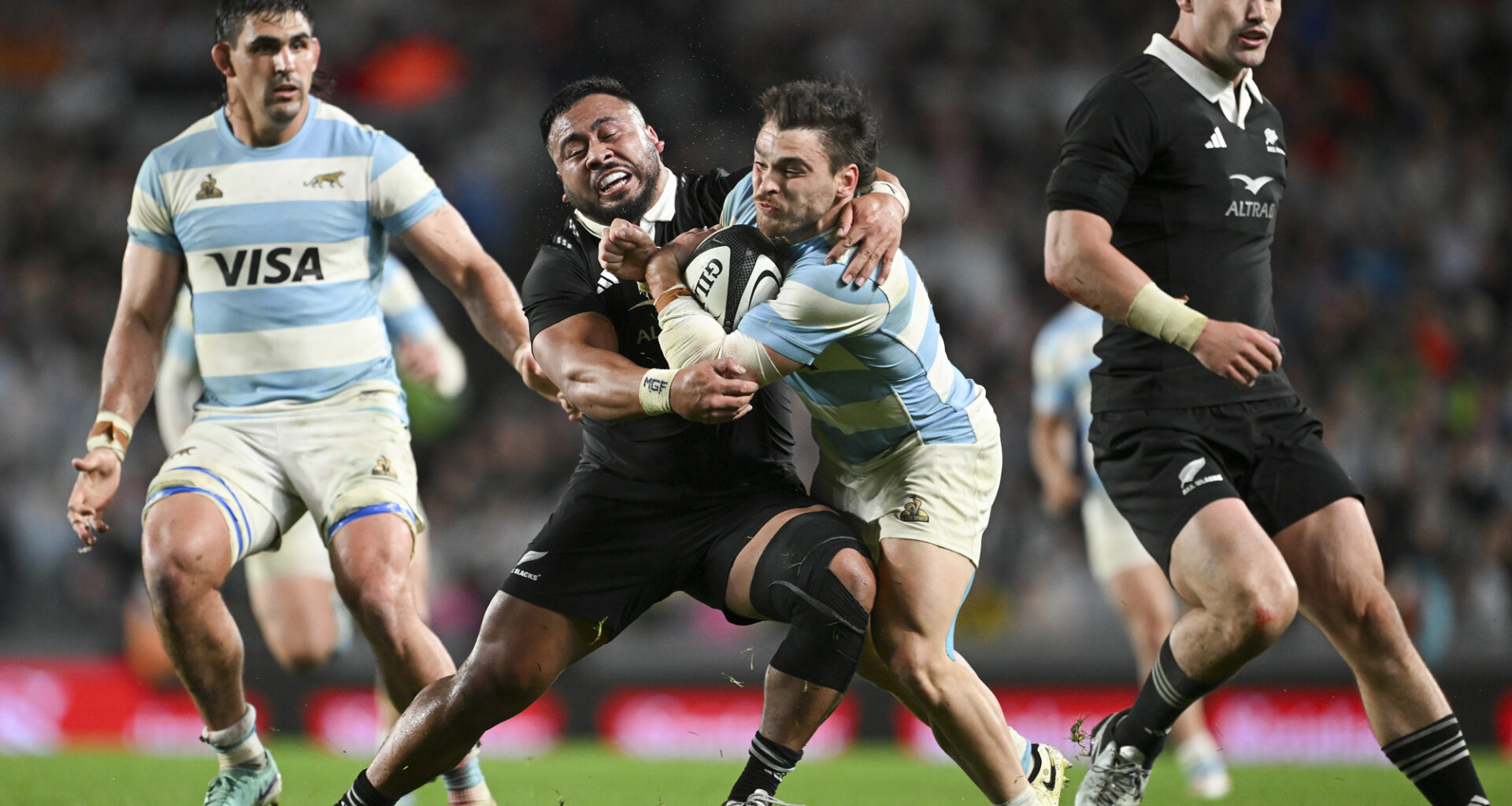 New Zealand’s Asafo Aumua tackles Argentina’s Mateo Carreras during a 2024 Rugby Championship match.