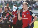 Sebastian Schonlau of Hamburger SV speaks to the fans through a megaphone following defeat in the Second Bundesliga match between SpVgg Greuther Fuerth 1903 and Hamburger SV at Sportpark Ronhof Thomas Sommer on May 18, 2025 in Fuerth, Germany.  