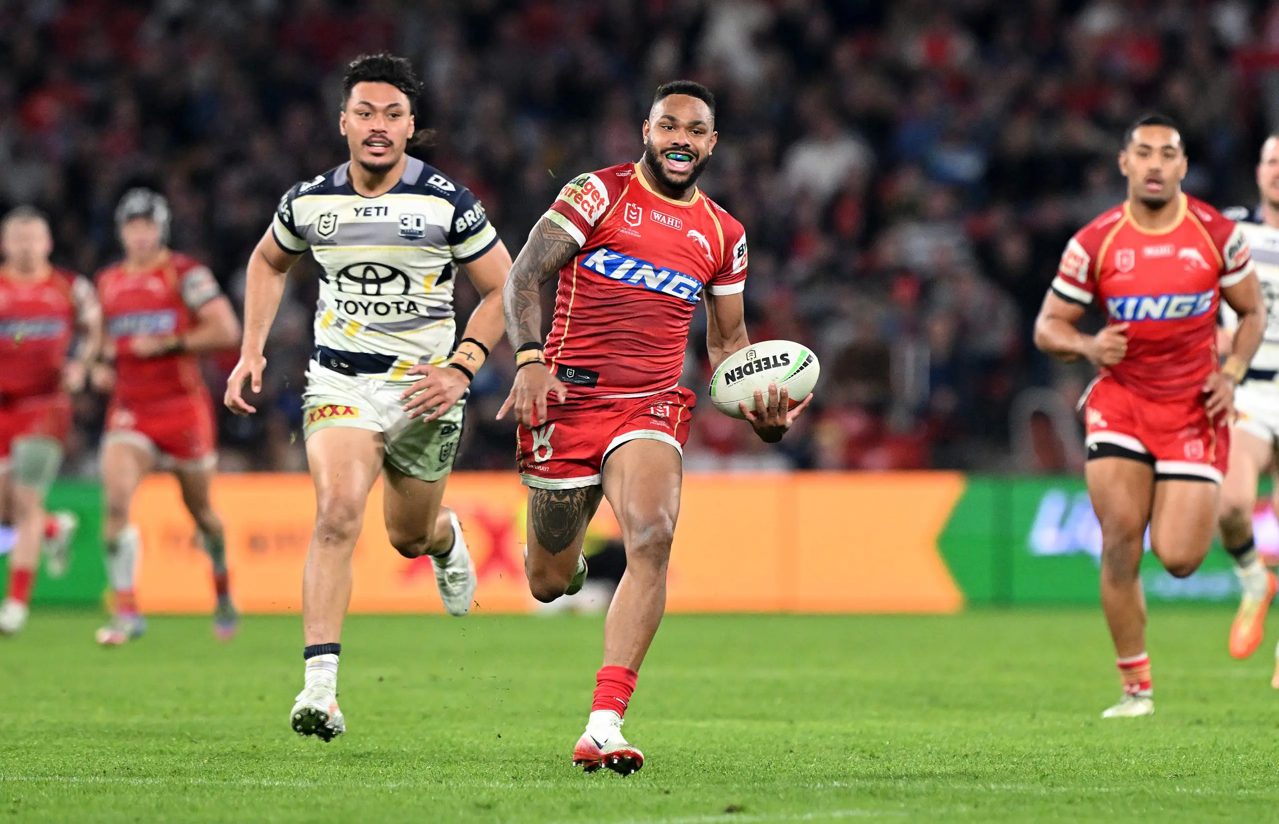 BRISBANE, AUSTRALIA - JULY 17: Hamiso Tabuai-Fidow of the Dolphins breaks away from the defence during the round 20 NRL match between Dolphins and North Queensland Cowboys at Suncorp Stadium, on July 17, 2025, in Brisbane, Australia. (Photo by Bradley Kanaris/Getty Images)