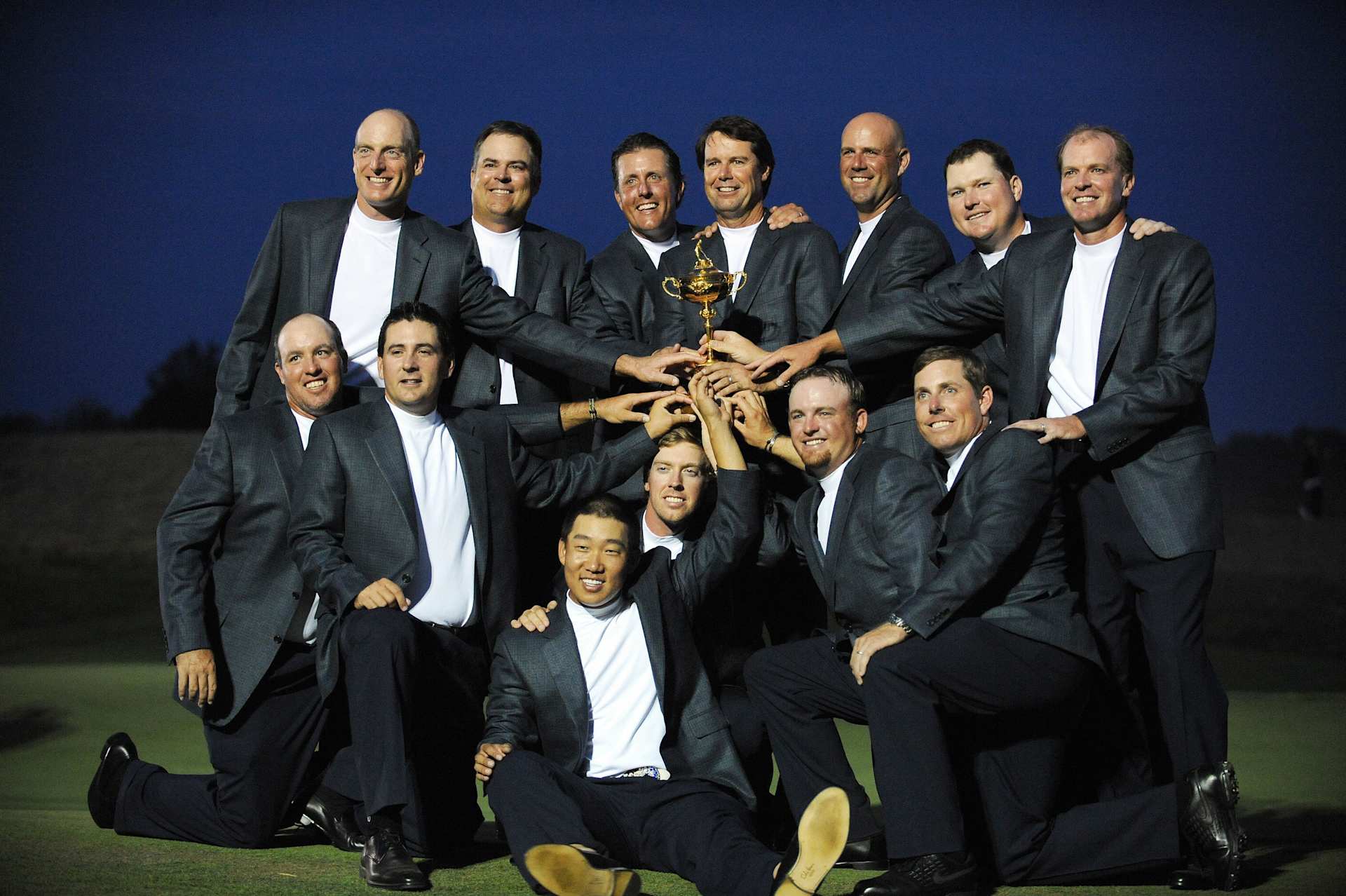 Team USA (top row L-R) Jim Furyk, Kenny Perry, Phil Mickelson, Captain Paul Azinger, Stewart Cink, Chad Campbell, Steve Stricker, (kneeling L-R) Boo Weekley, Ben Curtis, Anthony Kim, Hunter Mahan, J.B.Holmes and Justin Leonard pose with the Ryder Cup trophy at the end of the 37th Ryder Cup on September 21, 2008 at the Valhalla Golf Club in Louisville, Kentucky.           AFP PHOTO/TIM SLOAN (Photo credit should read TIM SLOAN/AFP via Getty Images)