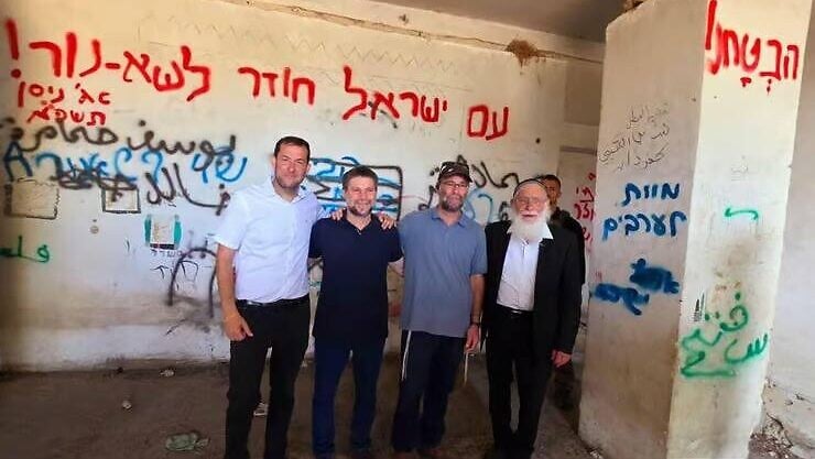 Smotrich photographed next to 'Death to Arabs' graffiti, disavows message