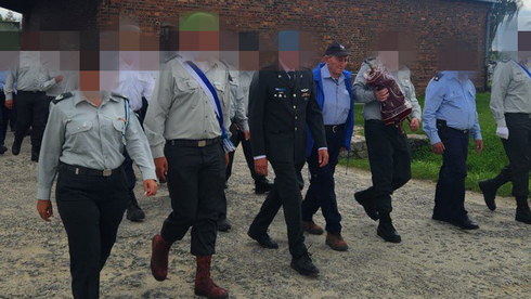 Israeli delegation to Poland's Nazi death camp forced to remove national flags